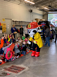 The Fire Department teaching elementary school children about fire awareness and safety at the Fire Station.